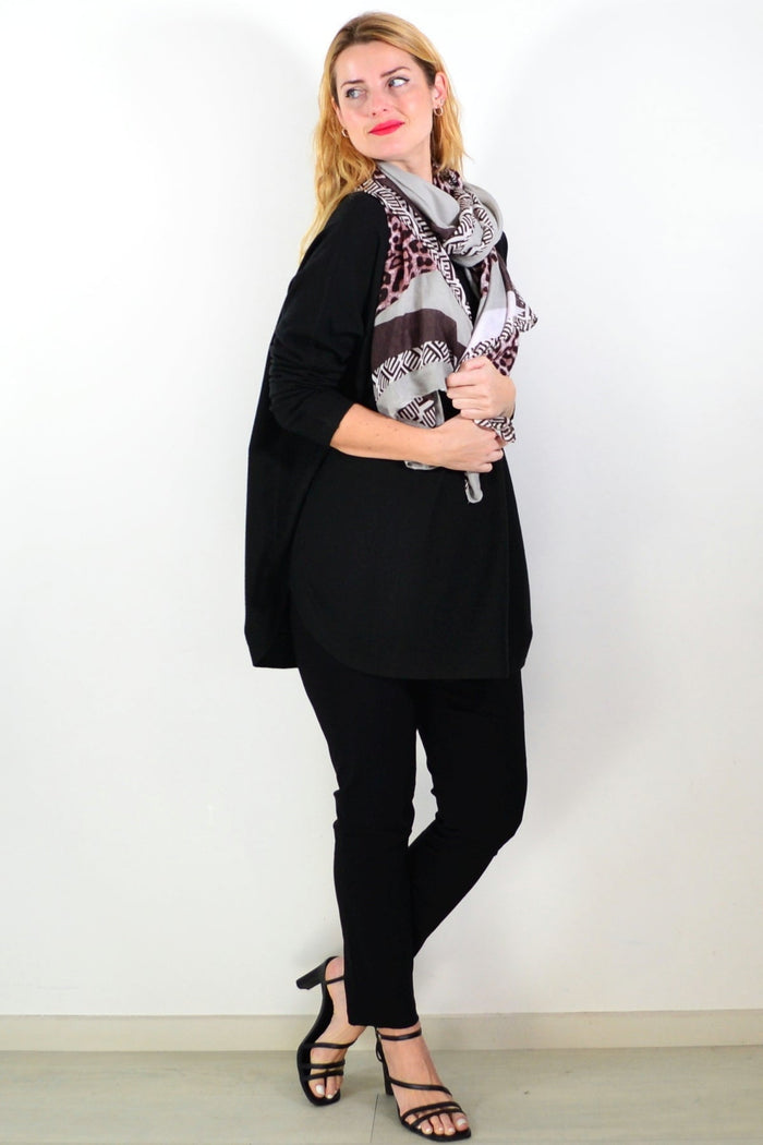Black winter warm tunic top by Hourglass, featuring a cozy, long-sleeve design with a relaxed fit and soft fabric.