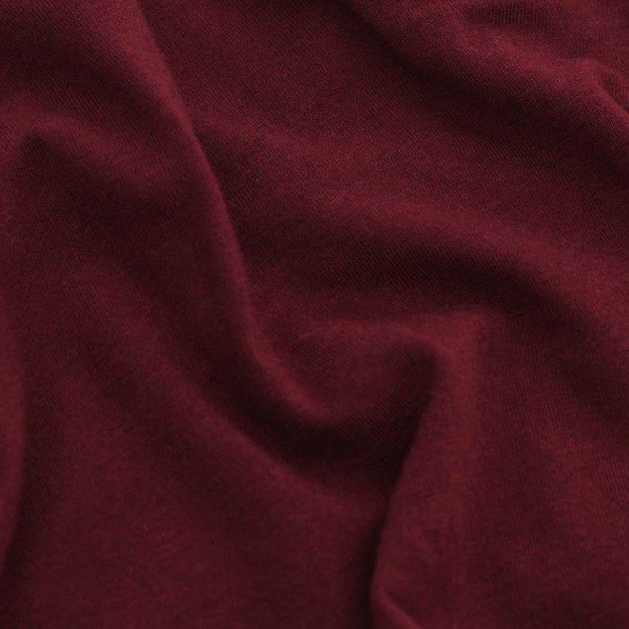 Burgundy Classic Long Sleeve Henley fabric close-up, showcasing knit texture.