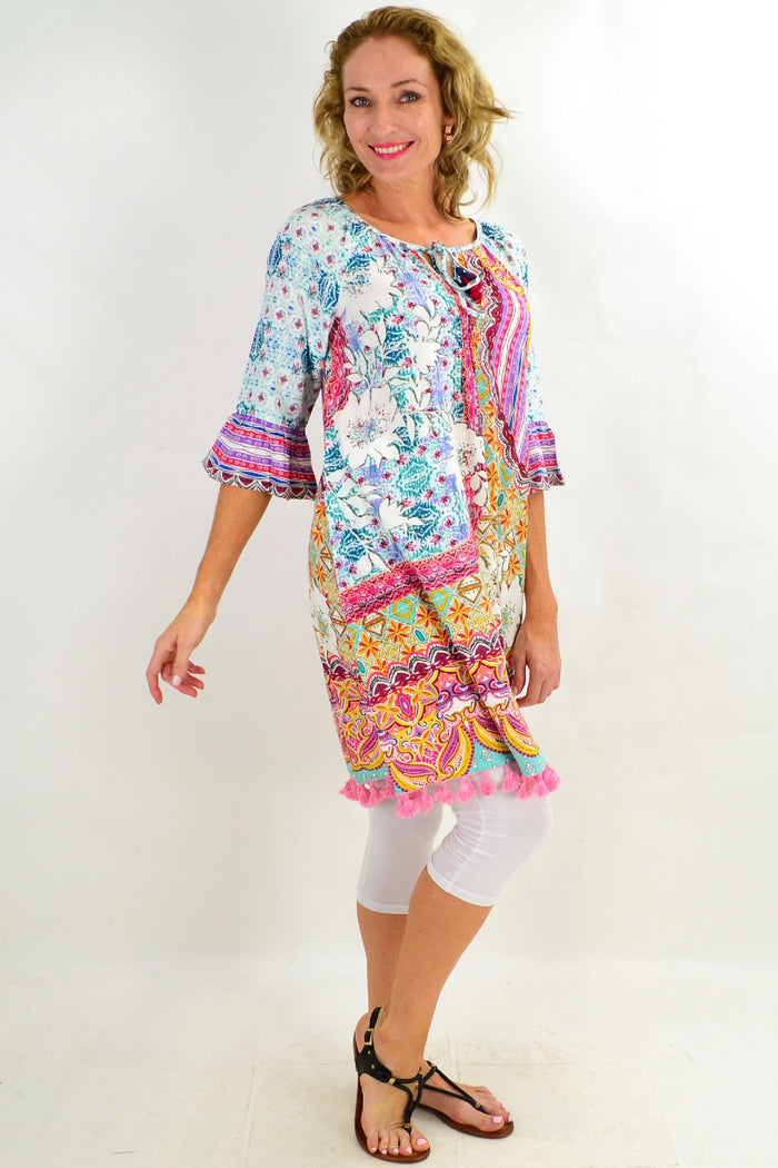 Chateau 3/4 sleeve tunic dress by Orientique, featuring a relaxed fit and stylish design, displayed on a hanger.