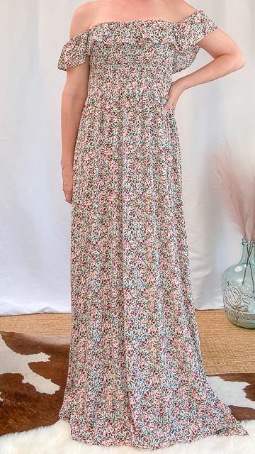 Off-shoulder floral maxi dress with smocked bodice and subtle side slit, feminine and elegant