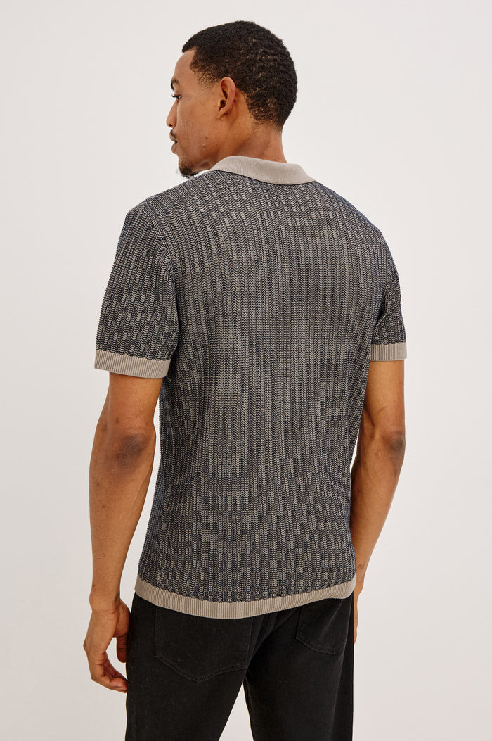 Langley Polo Shirt in Lightweight Contrast Open Birdseye Knit With Classic Fit, Open Collar, Short Sleeves, and Ribbed Trim in Oat Midnight Ripple Colorway - Upper Body Back View Featured on Model