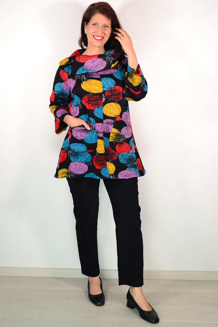 Wishstone multicoloured spots winter tunic top with long sleeves and relaxed fit, featuring vibrant spot patterns on soft fabric.