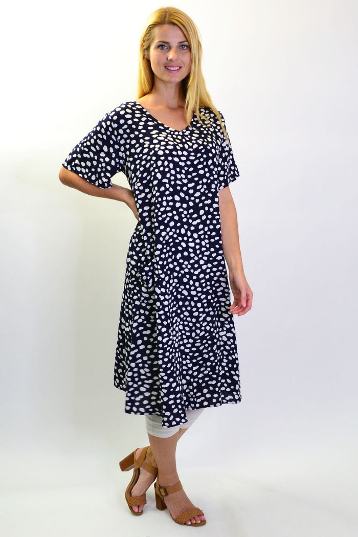 Navy dots and pockets tunic slip dress by Sunshine, showing a lightweight sleeveless dress with a relaxed fit and side pockets.