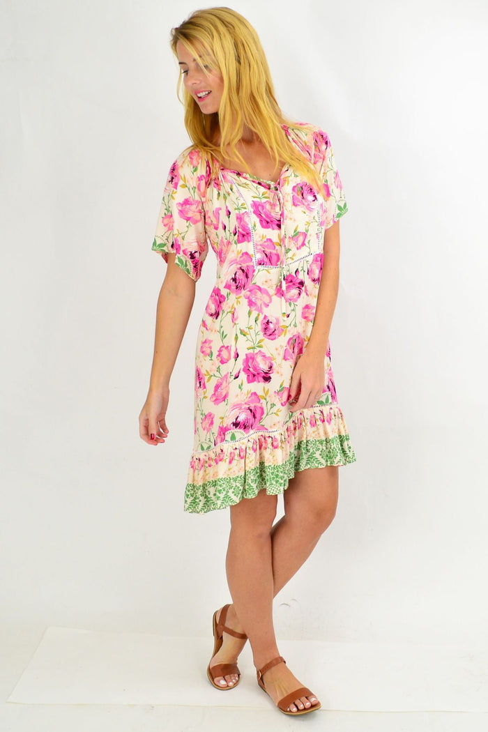 Pink rose flowy tunic dress from New U Collection, featuring a lightweight fabric and relaxed fit, displayed on a hanger.