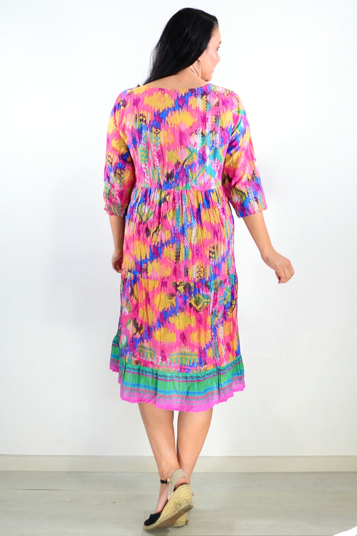 Rebecca Holi tie neck tunic dress by One Summer, featuring a relaxed fit and vibrant pattern, displayed on a model.