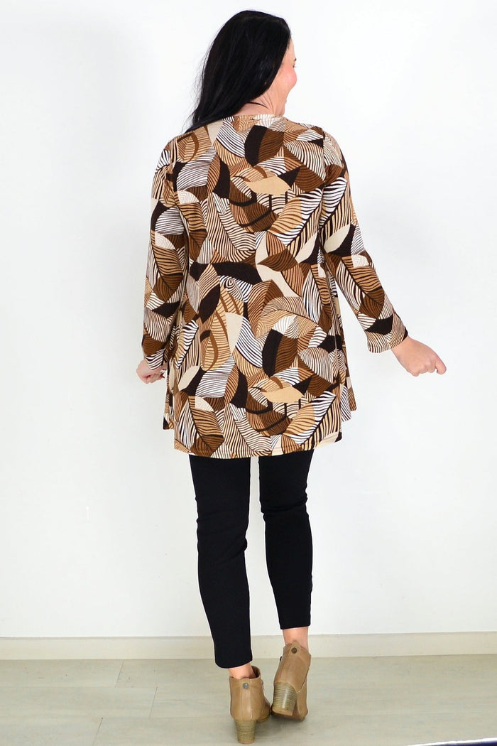 Brown fleece tunic top with winter leaf pattern from Hourglass, featuring a cozy, relaxed fit and detailed leaf embroidery.