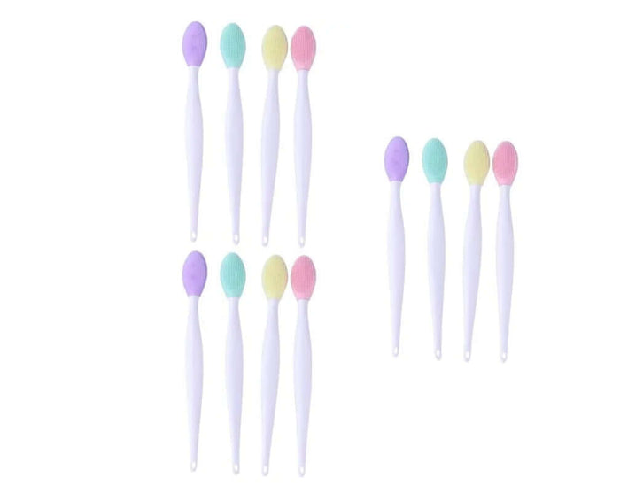 Set of pastel-colored silicone toothbrushes on a white background