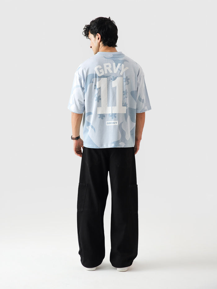 Allover GRVY frost blue tee male model full body front view allover print Pakistan – GROOVY