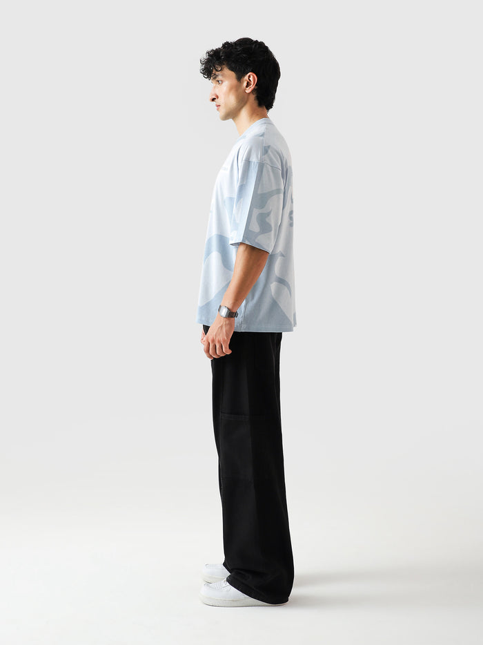 Allover GRVY frost blue tee male model side angle oversized Pakistan – GROOVY