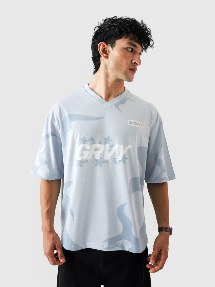 Allover GRVY frost blue tee female model front view allover print streetwear Pakistan – GROOVY