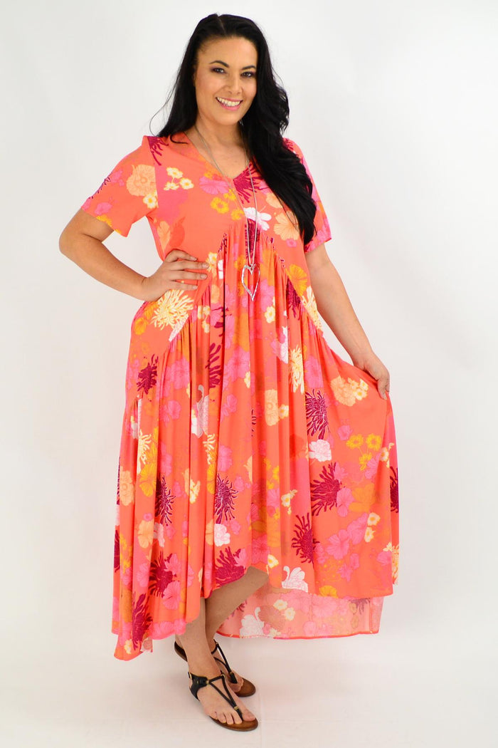 Apricot floral maxi tunic dress from New U Collection, featuring a flowing design with vibrant floral patterns and lightweight fabric.