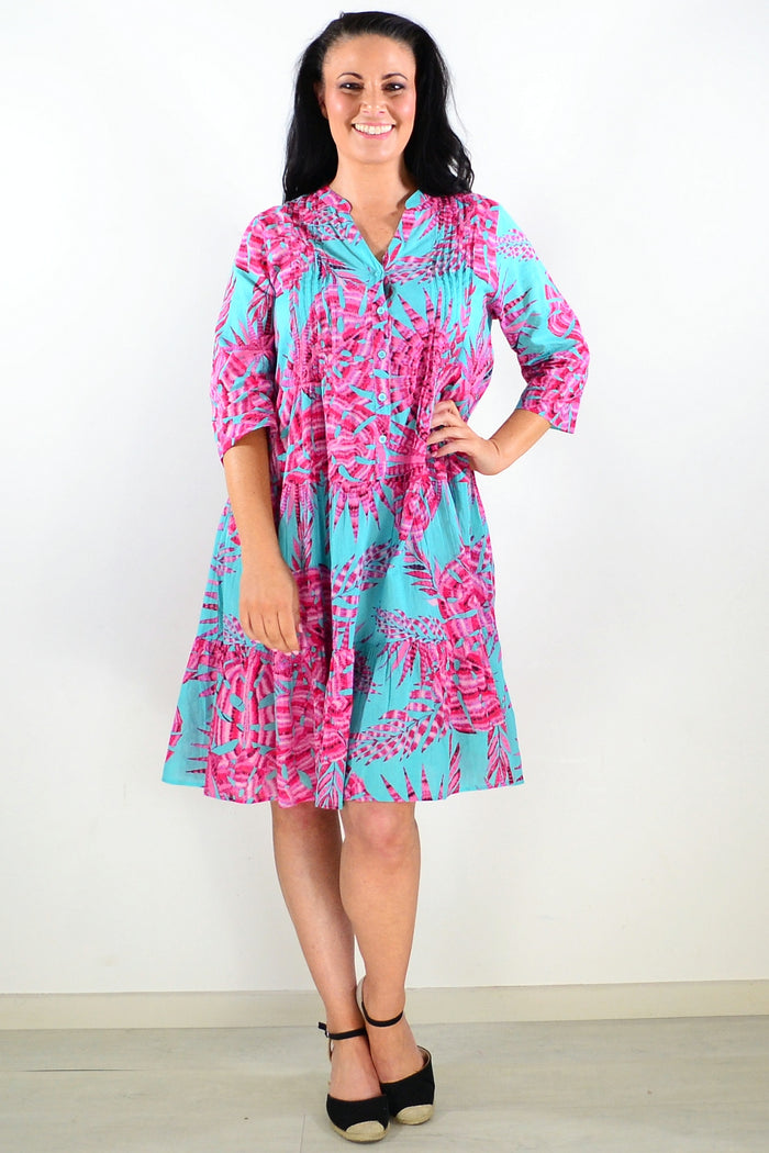 Aqua pink Beth tunic dress by One Summer featuring a relaxed fit, lightweight fabric, and stylish design, displayed on a hanger.