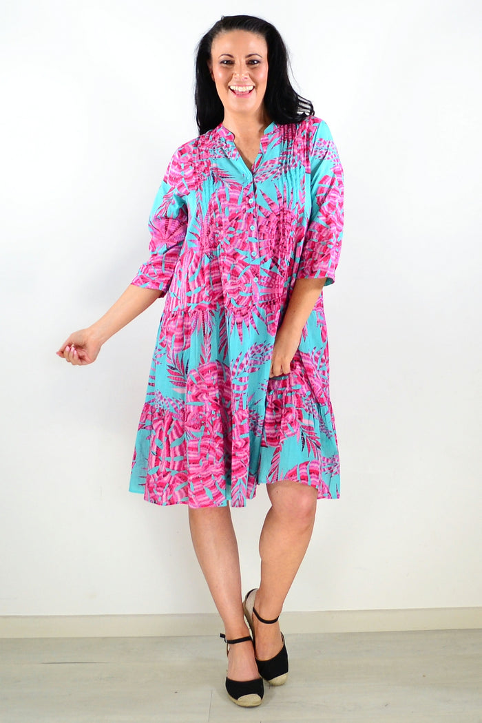 Aqua pink Beth tunic dress by One Summer, featuring a flowy, lightweight fabric and a relaxed fit, displayed on a hanger.