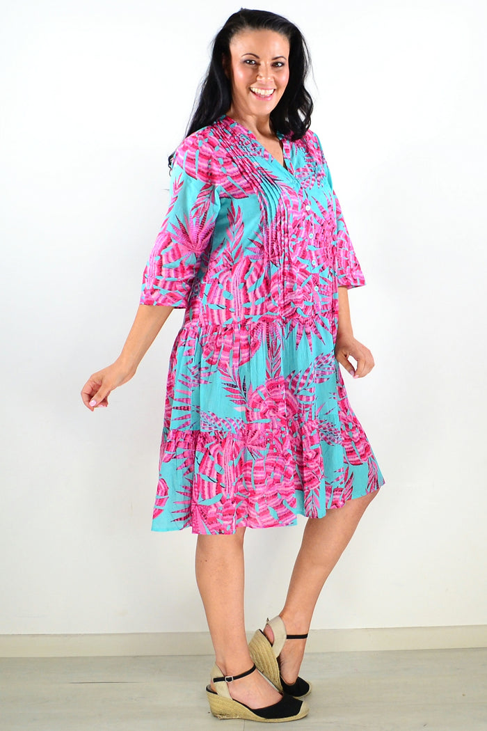 Aqua pink Beth tunic dress by One Summer featuring a flowy fabric, short sleeves, and a relaxed fit, displayed on a white background.