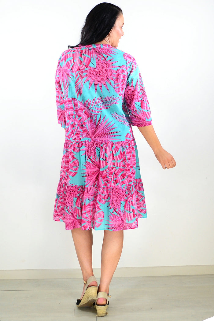 Aqua pink Beth tunic dress by One Summer, featuring flowy fabric and relaxed fit displayed on a hanger.