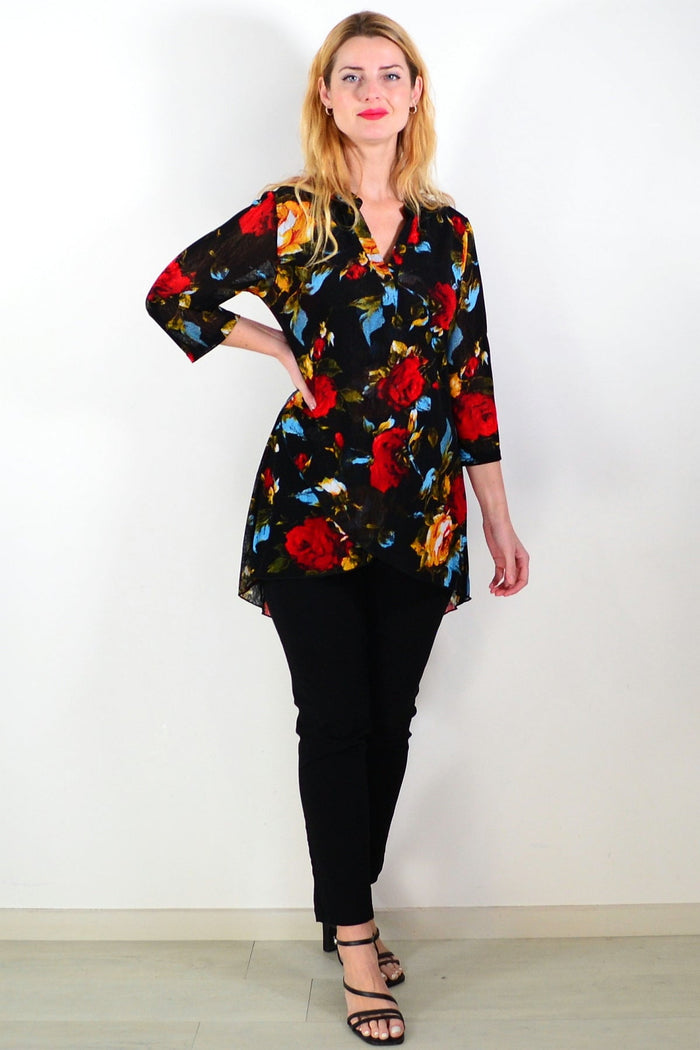 Black floral mesh ladies tunic top by Whispers, featuring lightweight, semi-sheer fabric with a floral pattern and relaxed fit.