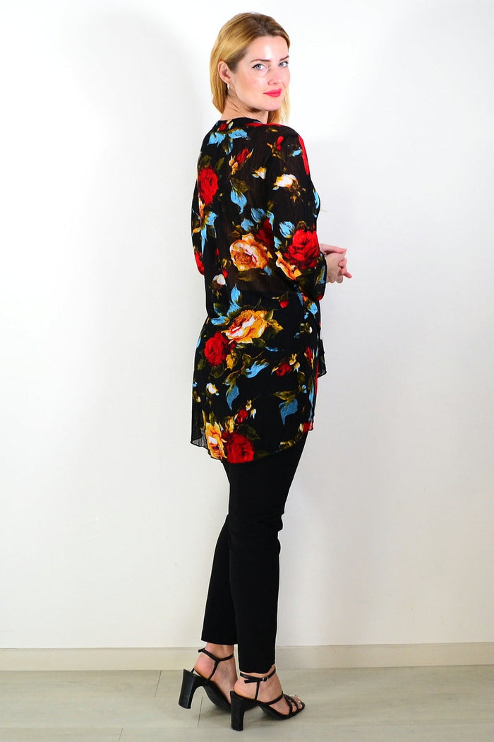 Black floral mesh ladies tunic top by Whispers, showcasing a stylish, lightweight design with floral patterns and mesh fabric.