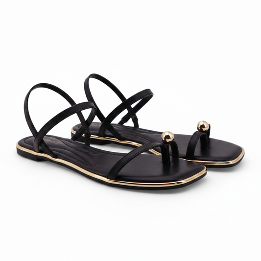 Black Sandals featuring a delicate gold toe ring