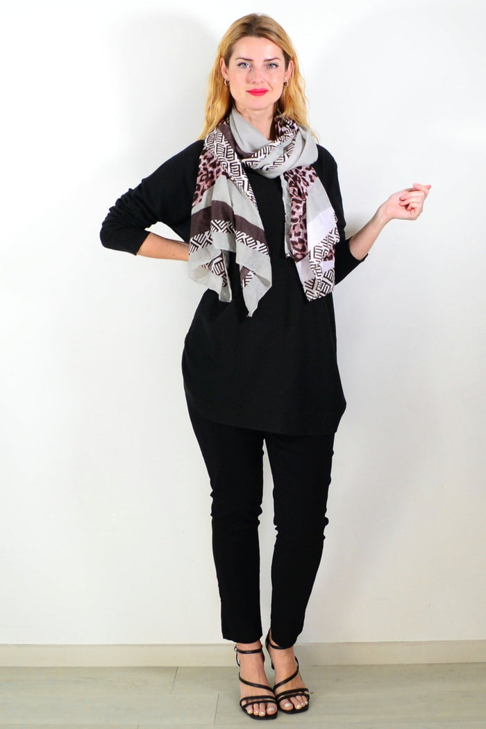 Black Winter Warm Tunic Top by Hourglass, showing a cozy, long-sleeve tunic with a relaxed fit and soft fabric on a mannequin.