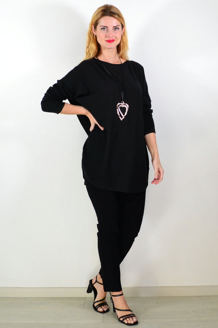 Black winter warm tunic top by Hourglass, featuring a cozy, long-sleeve design perfect for cold weather and layered styling.