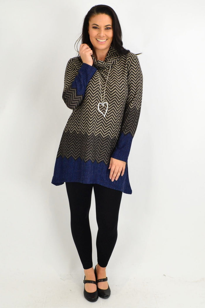Blue zig zag print Whispers winter tunic with roll neck and long sleeves, displayed on a hanger against a plain background.