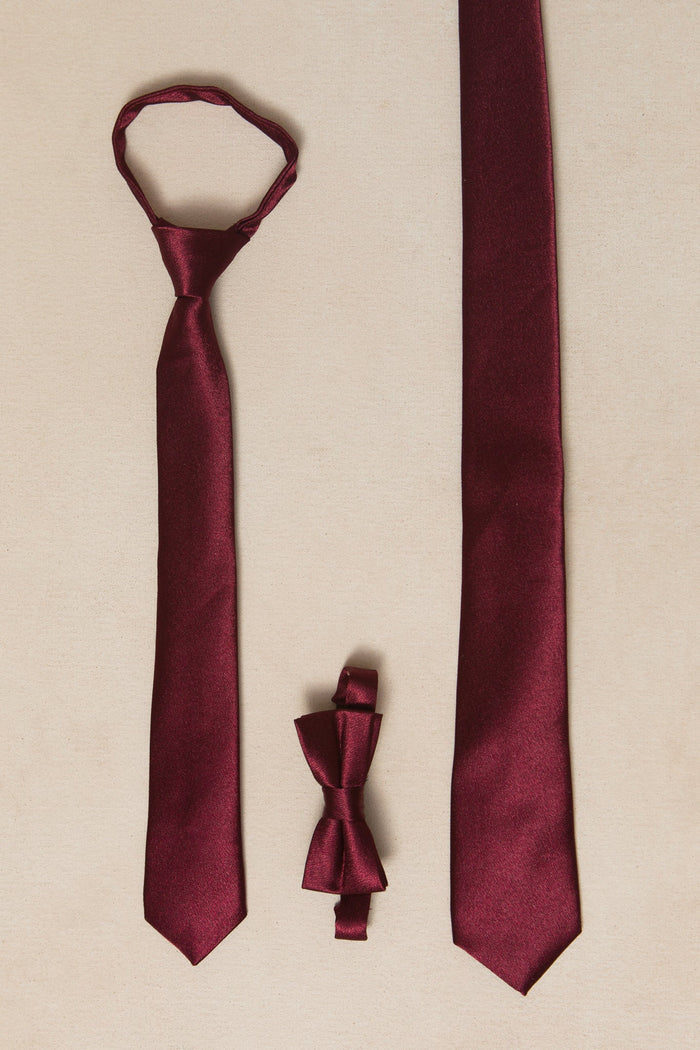 Three maroon accessories from Ivy City Co displayed on a beige background: the Boys Max Tie in Wine Satin with a loose knot, a classic necktie, and a pre-tied bow tie—perfect choices for fall weddings—all arranged vertically.