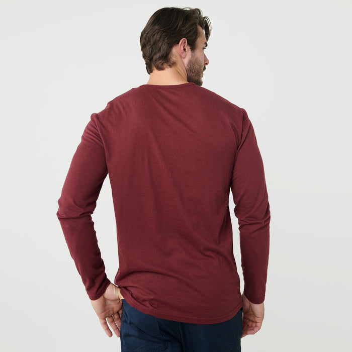 Man wearing Burgundy Classic Long Sleeve Henley, shown from behind.
