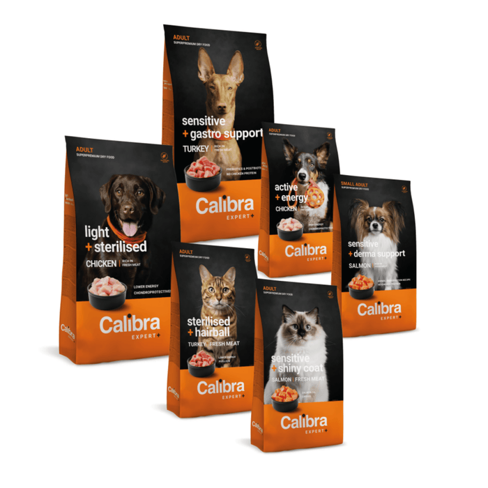 Six bags of Calibra Super pet food for dogs and cats arranged together on a white background. The bags are black and orange with photos of different dogs and cats, and text indicating various support diets such as sensitive gastro support, light sterilised chicken, active energy chicken, sterilised hamster, protein rich cat, and salmon.