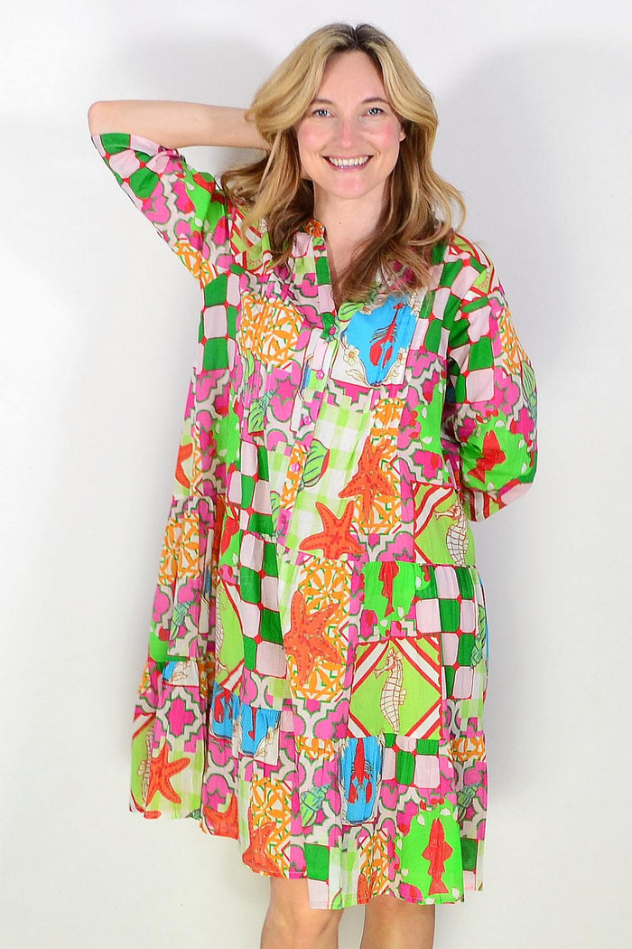 One Summer Coastal Vacation Beth Tunic Dress displayed on a hanger, featuring lightweight fabric and casual summer style.