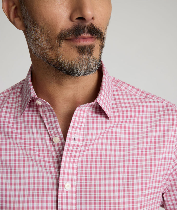 Model is wearing UNTUCKit Kaiser cottontek shirt in red.