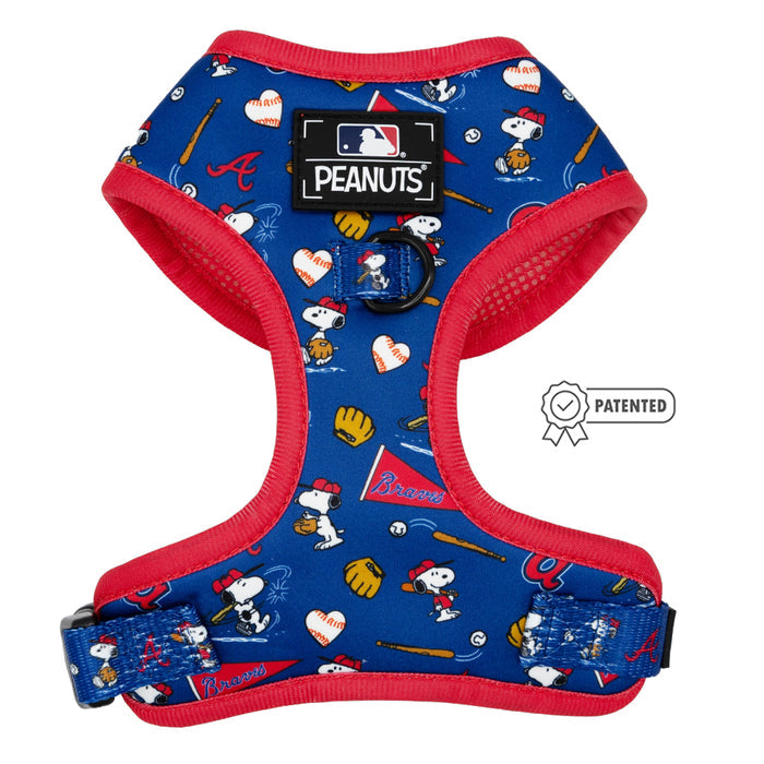 The Sassy Woof Dog Two Piece Bundle - MLB™ x Peanuts™ Atlanta Braves™ features a blue and red Snoopy harness with Peanuts and team logos, cartoon Snoopy, Woodstock, bats, gloves, hearts, a PEANUTS patch, and “patented” badge—an adorable baseball dog accessory.