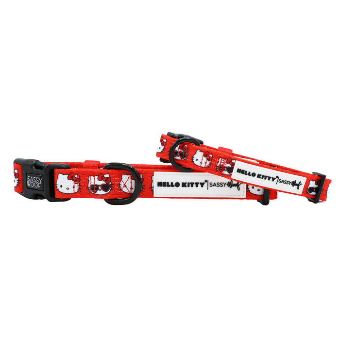 Two Sassy Woof "Dog Collar - Hello Kitty® Red Classic" collars feature red adjustable straps, black buckles, metal rings, HELLO KITTY text, cute faces, and the brand logo—ideal pet accessories for Hello Kitty fans.
