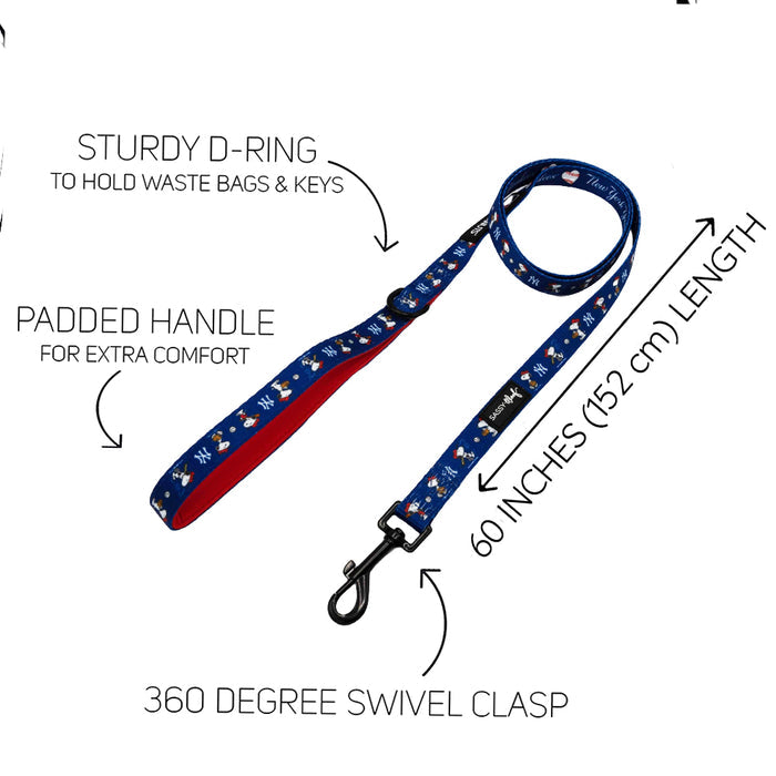 The Sassy Woof Dog Two Piece Bundle - MLB™ x Peanuts™ New York Yankees™ features a blue leash with paw prints, padded handle, sturdy D-ring, 60" length, and 360° swivel clasp. Perfect with the Snoopy harness or other MLB x Peanuts Yankees gear. Labels highlight each feature.