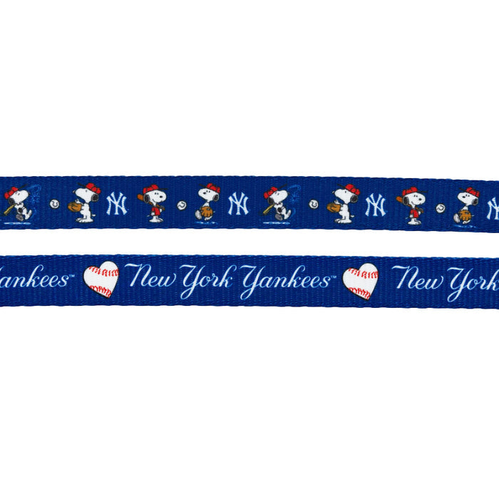 The Sassy Woof Dog Two Piece Bundle - MLB™ x Peanuts™ New York Yankees™ features a blue leash with Snoopy in baseball poses, Yankees logos, "New York Yankees" text, and heart-shaped baseballs.