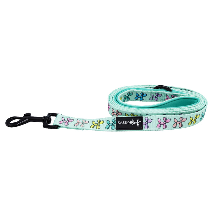The Sassy Woof Dog Leash - Pup Pup Hooray features a charming flower design and a soft neoprene handle for comfortable walks.