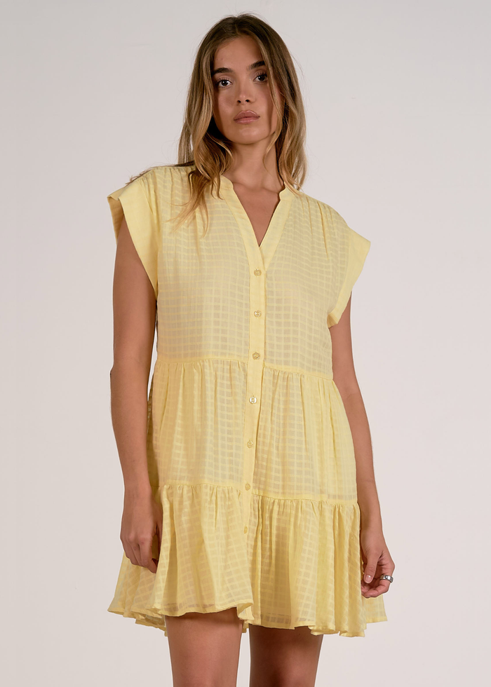 Woman wearing a yellow mini dress
