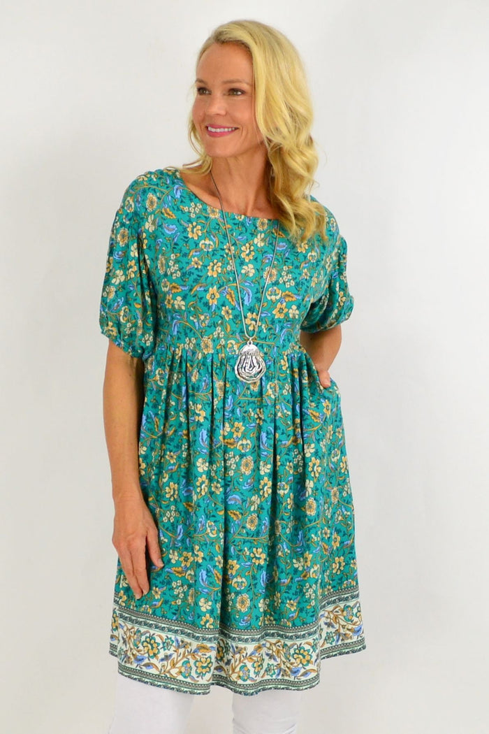 Emerald green puff sleeve tunic dress by Indigo Designs with floral pattern, lightweight and stylish for casual wear.