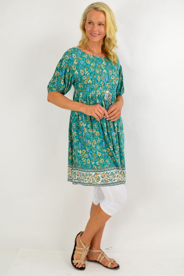 Emerald green puff sleeve tunic dress by Indigo Designs, featuring a flowing silhouette and stylish puffed sleeve details.