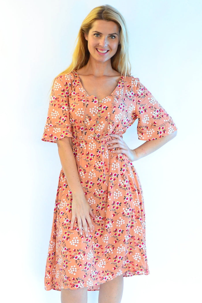 Dull orange Zen Garden Field of Flowers tunic dress with floral pattern, flowing fabric, and relaxed fit, perfect for casual wear.