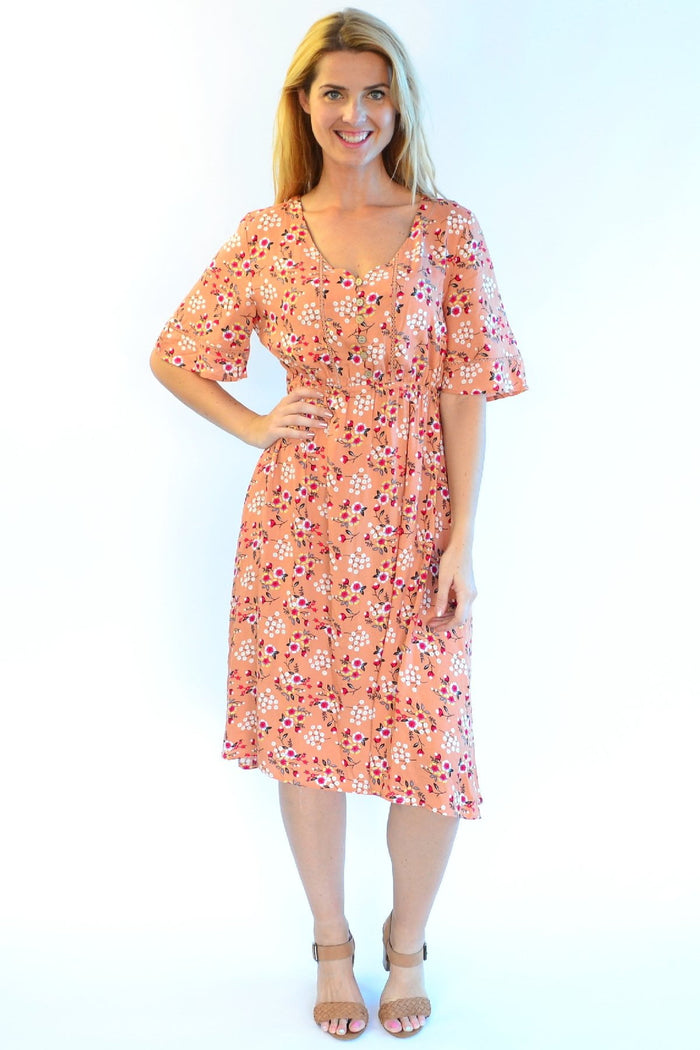 Dull orange Zen Garden Field of Flowers tunic dress with floral pattern, lightweight and casual for everyday wear.