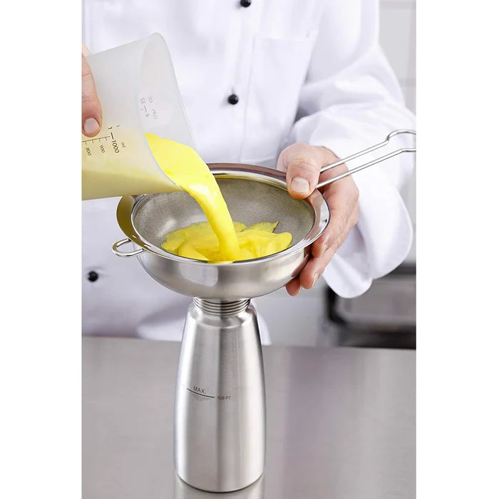 egg yolks being poured by chef into Funnel & Sieve from iSi kit.