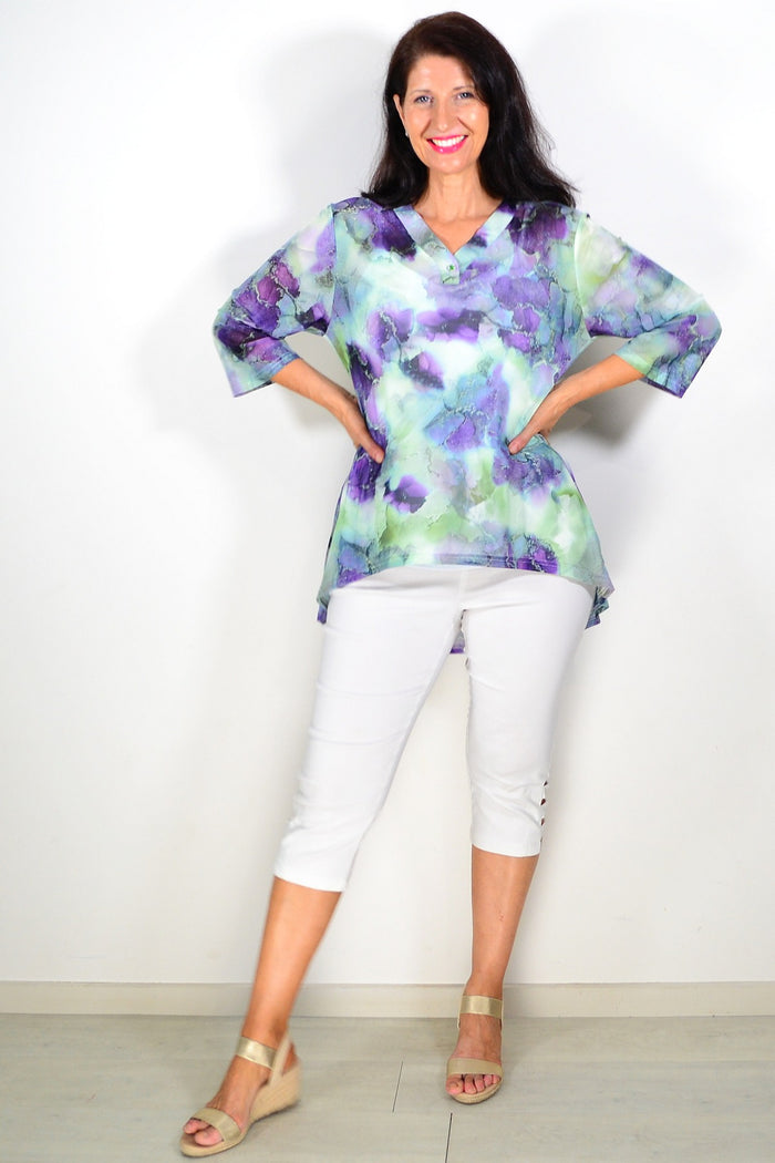 Green and purple mesh ladies tunic top by Whispers, featuring a flowing design and intricate fabric details.