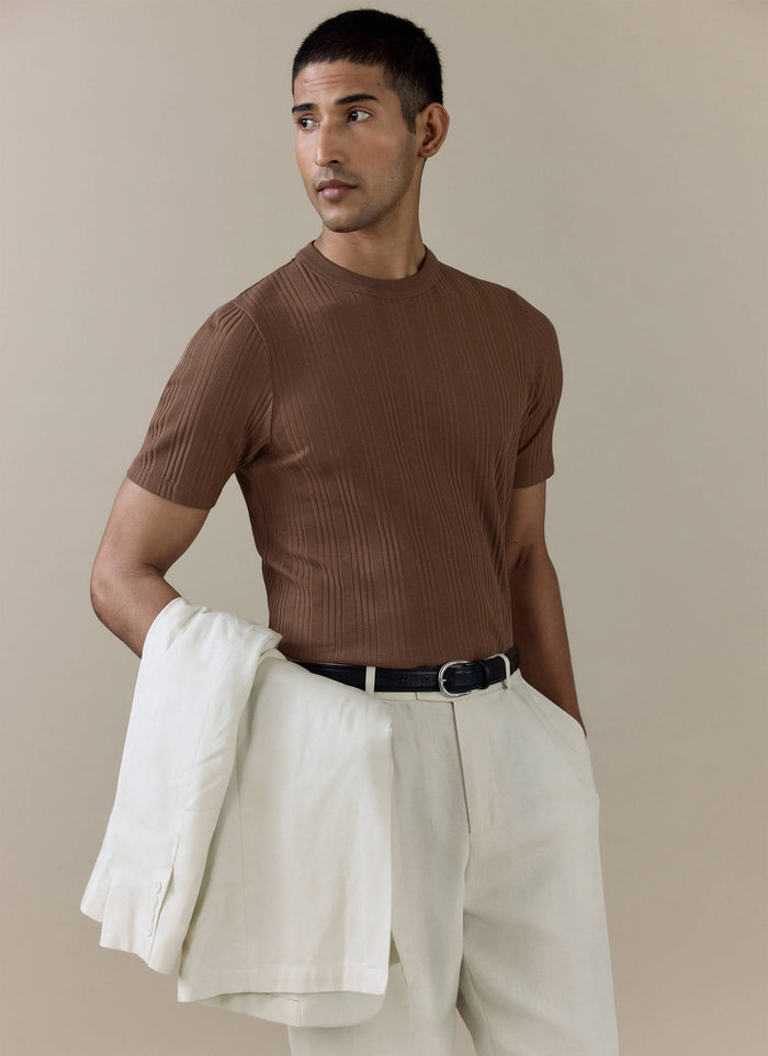 Espresso brown Percival Leon Slim Ribbed T Shirt in organic cotton, styled with a cream linen blazer and trousers.