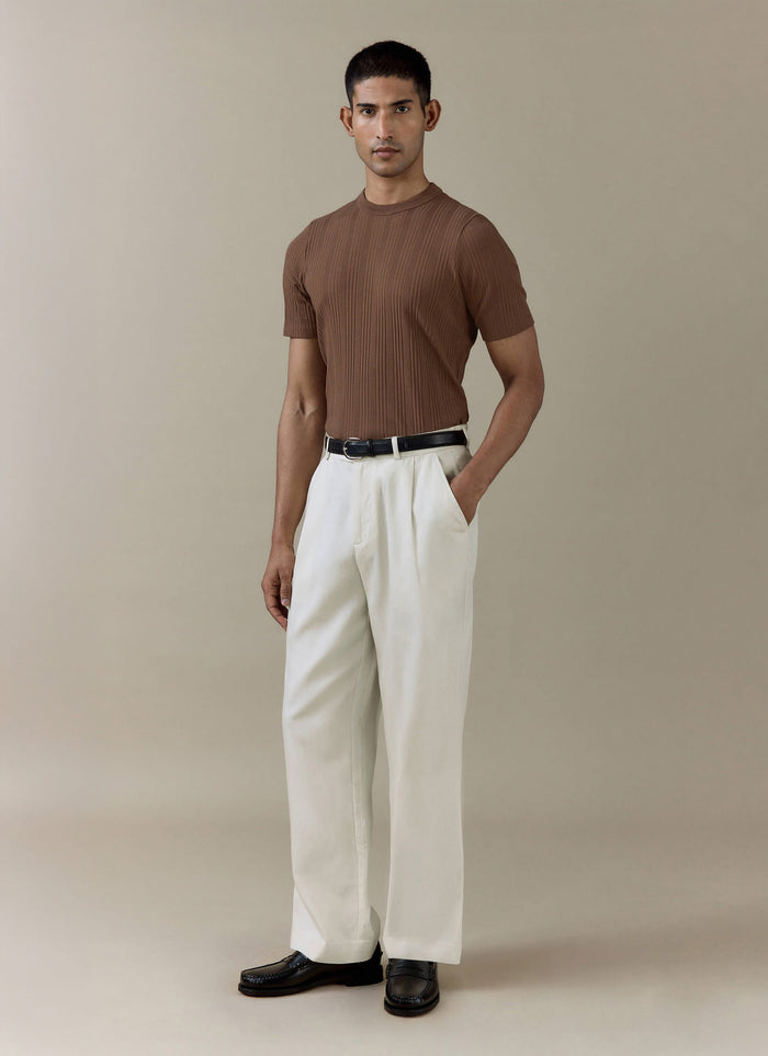 Espresso brown Percival Leon Slim Ribbed T Shirt in an organic cotton blend, paired with cream tailored trousers.