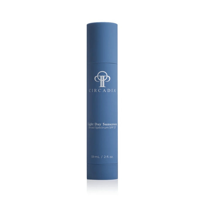 Blue cylindrical container of Light Day Sunscreen Broad Spectrum SPF 37 | Circadia, designed for skincare and sun protection.