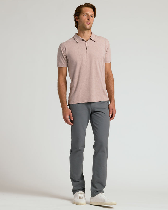 Young man wearing Light Heather Slate Mauve Classic Polo.