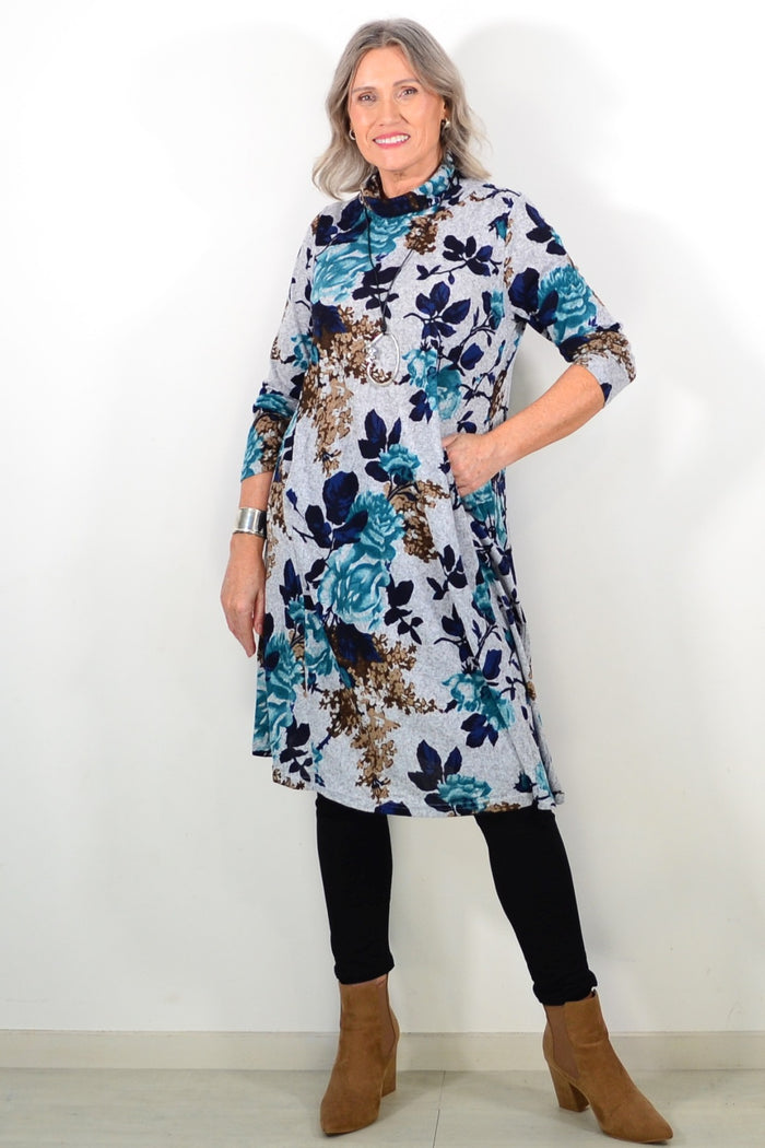 Long green floral La Mode winter tunic with a roll neck and long sleeves, featuring a vibrant floral pattern.