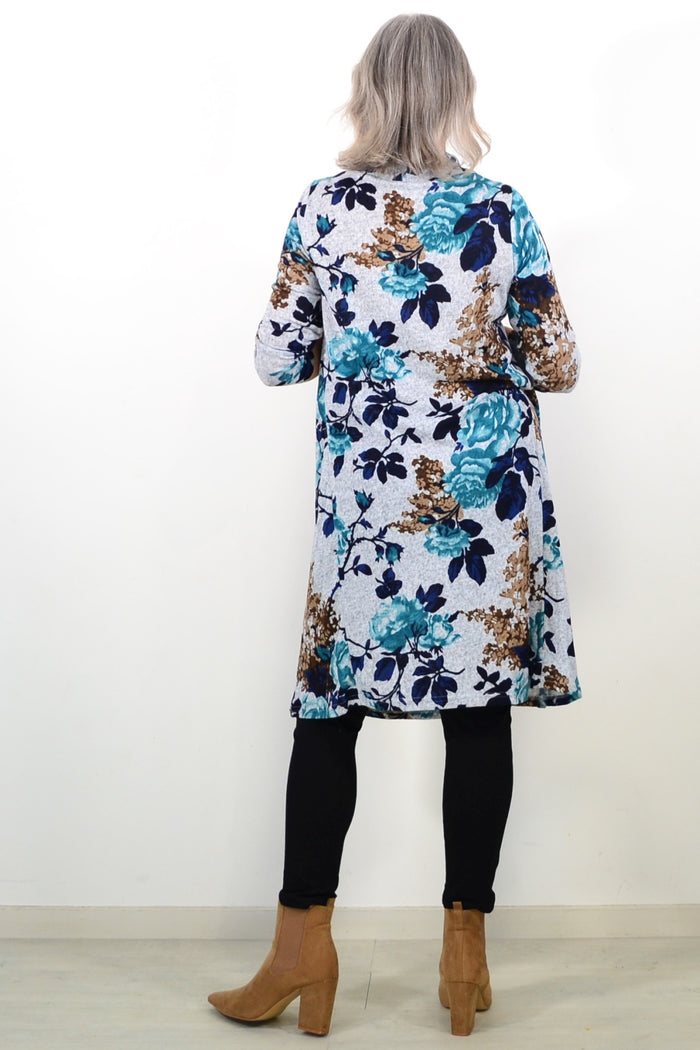 Long green floral roll neck winter tunic by La Mode, featuring a cozy fit and floral pattern, shown on a mannequin.