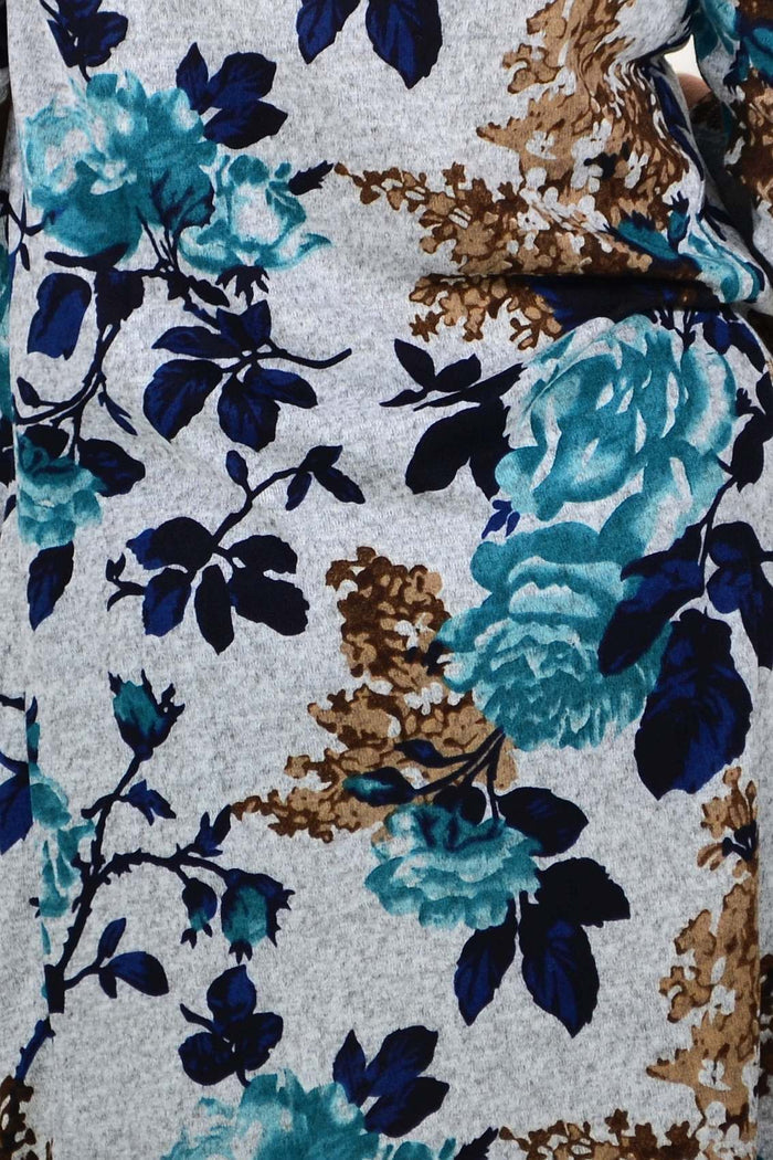 Long green floral La Mode winter tunic with roll neck, featuring a cozy, floral-patterned design perfect for cold weather.