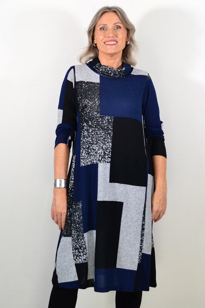 Long navy grey roll neck winter tunic by Hourglass Avalon, featuring a cozy design and soft fabric for cold weather wear.